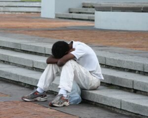 Boy alone on steps
