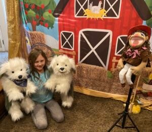 Farm Animal backdrop with twin stars of "Some Dogs Live in the City" song. The Grass is Green musical, by Penelope Torribio.